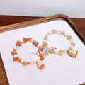 Handmade dried flower lucky charm bracelet with natural yellow crystal sunstone and freshwater pearl – a gentle and elegant accessory