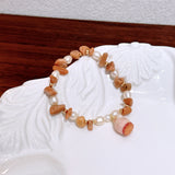Handmade dried flower lucky charm bracelet with natural yellow crystal sunstone and freshwater pearl – a gentle and elegant accessory