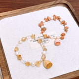 Handmade dried flower lucky charm bracelet with natural yellow crystal sunstone and freshwater pearl – a gentle and elegant accessory